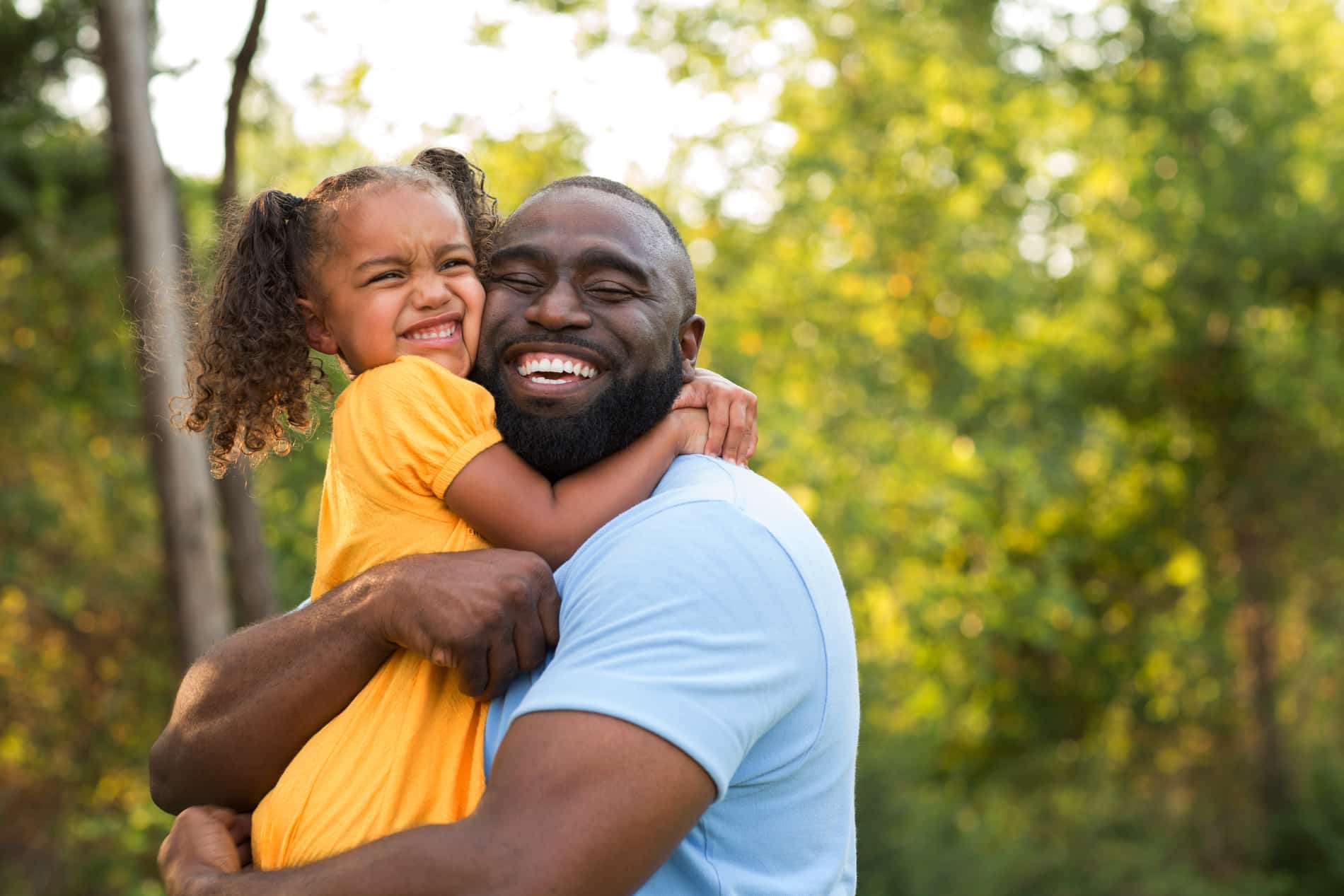 Father plays with his daughter excited about his new cosmetic smile in Nephi